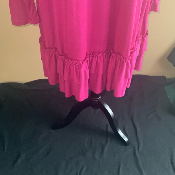 Long sleeve dress with tier ruffles on the bottom, length is passed the knee. - Picture 3 of 6